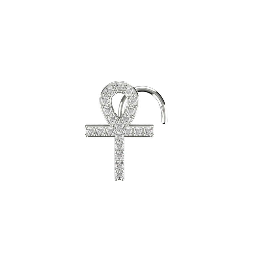 Gold cross nose piercing