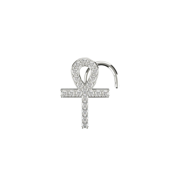 Gold cross nose piercing