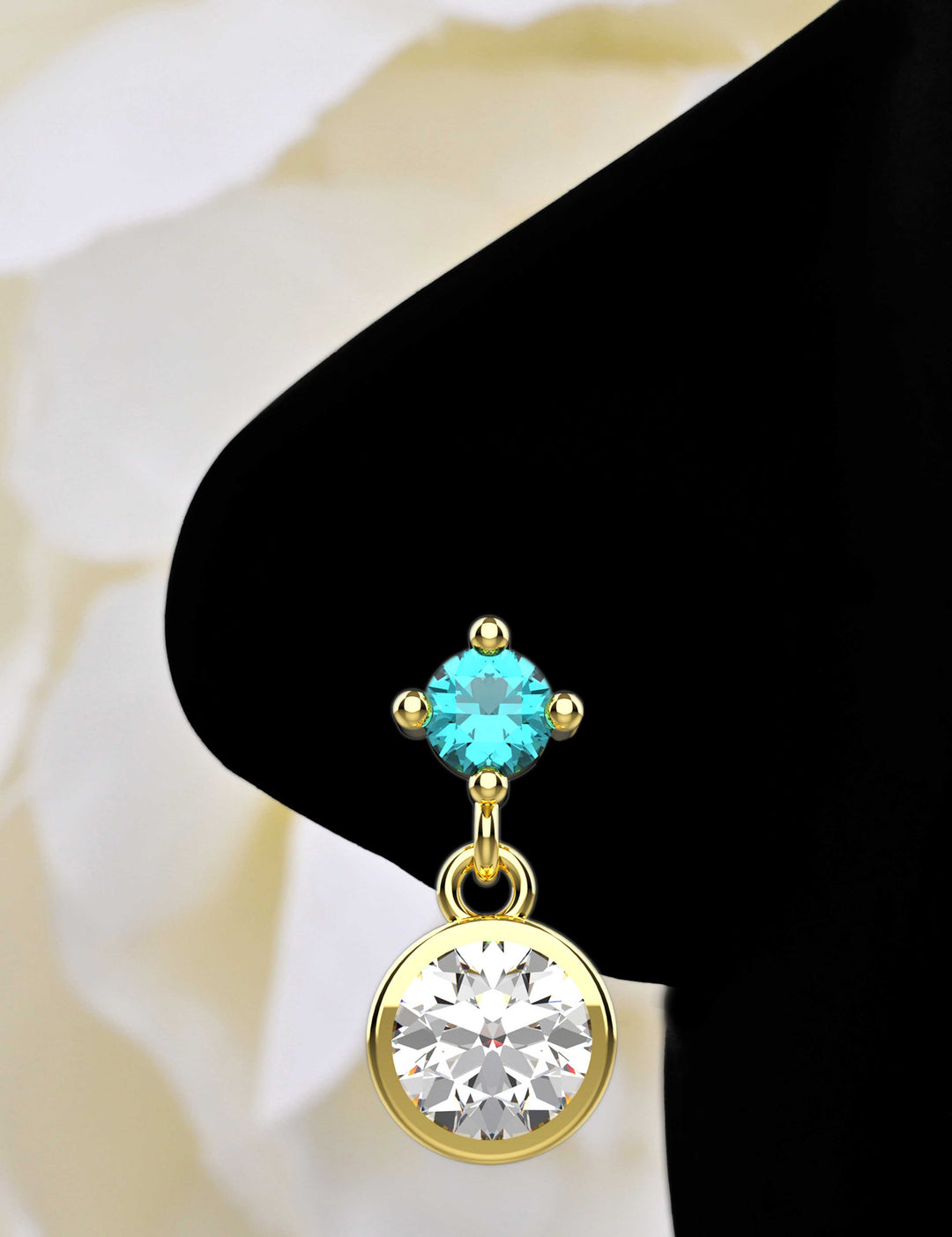Gold dangling nose piercing
