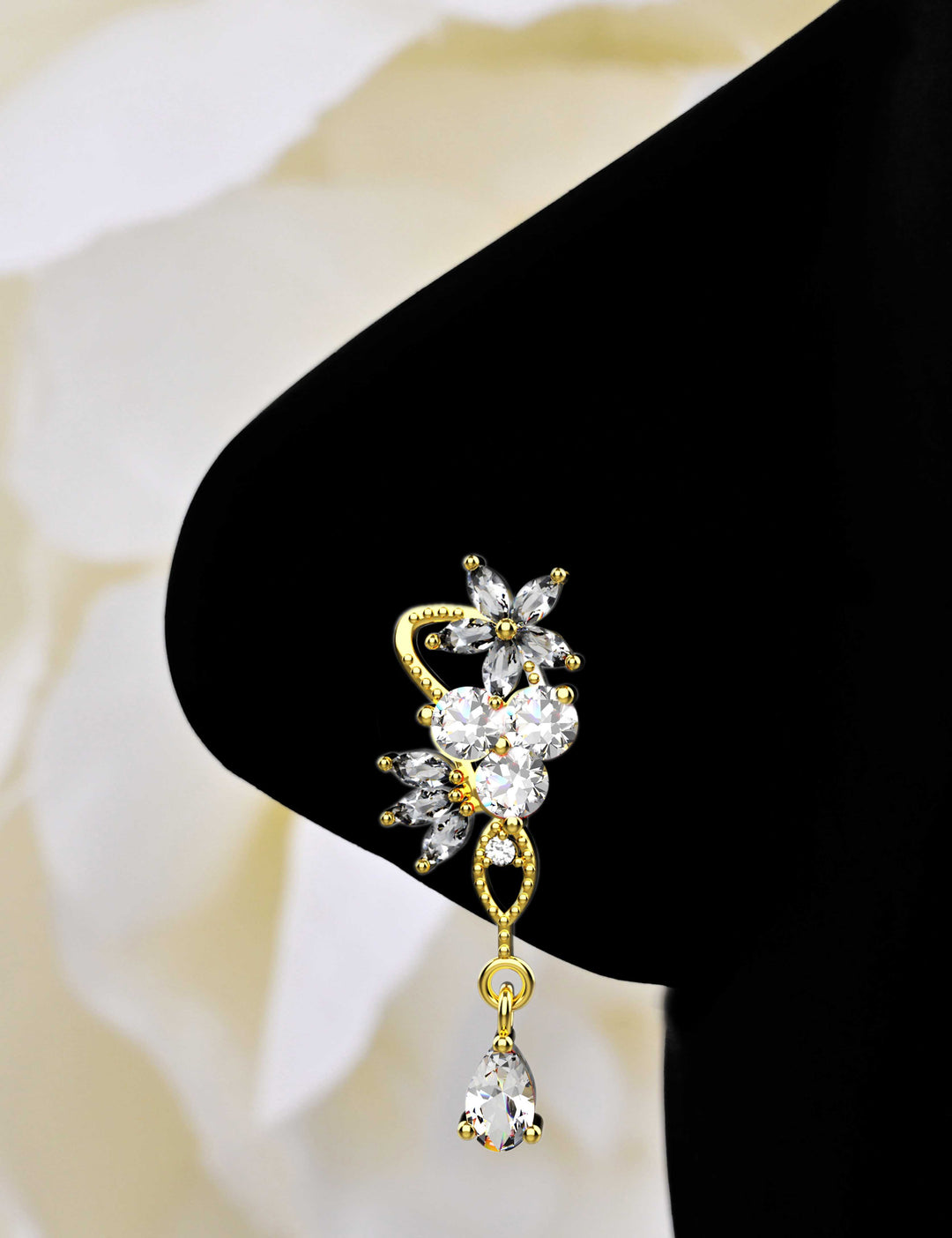 Gold dangle nose ring piercing