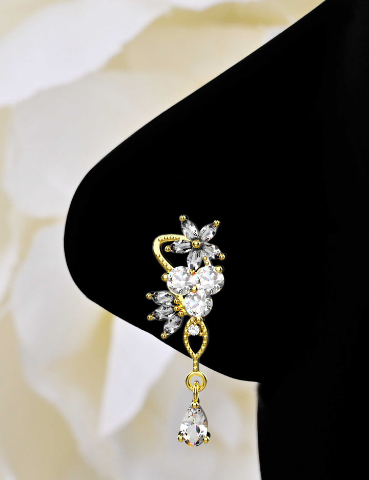 Gold dangle nose ring piercing