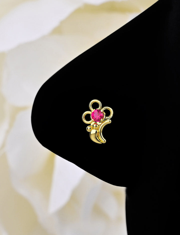 Dainty gold nose piercing