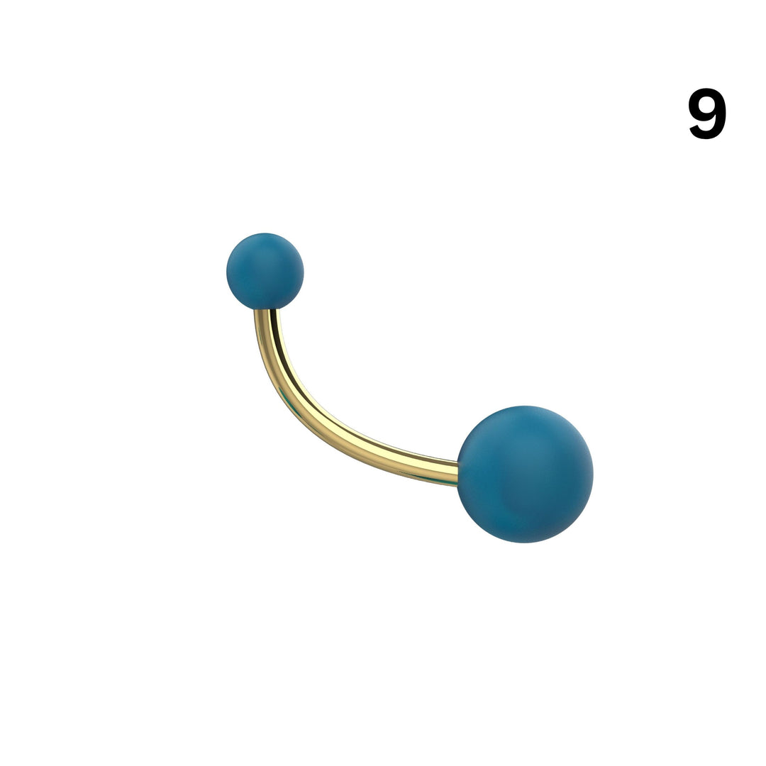 Curved banana bar ball belly ring side angle view